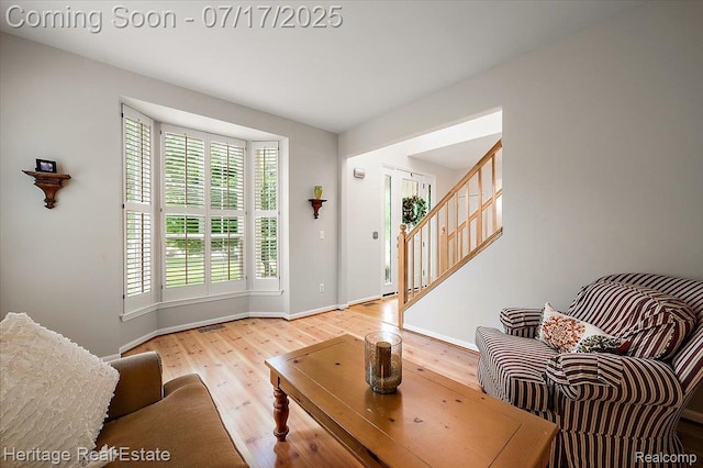 3066 Waldon Park Dr, Orion, MI 48359 - living room featuring wood finished floors and stairway