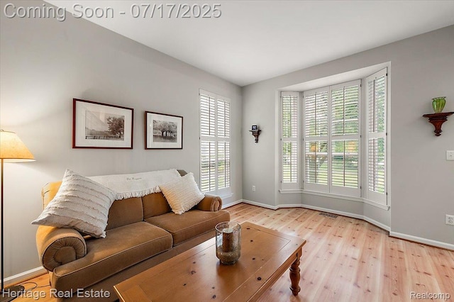 3066 Waldon Park Dr, Orion, MI 48359 - living room featuring healthy amount of natural light and wood finished floors