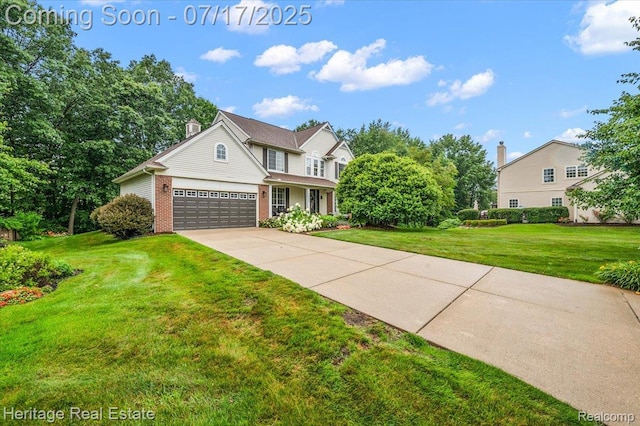 3066 Waldon Park Dr, Orion, MI 48359 - traditional-style house featuring brick siding, a front lawn, an attached garage, and concrete driveway