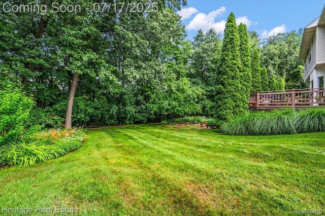 3066 Waldon Park Dr, Orion, MI 48359 - view of grassy yard featuring a wooden deck