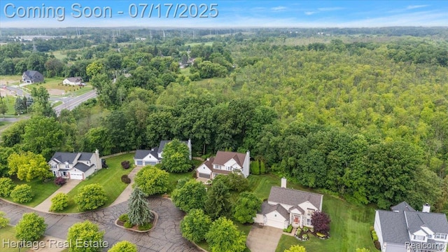3066 Waldon Park Dr, Orion, MI 48359 - aerial perspective of suburban area featuring a heavily wooded area