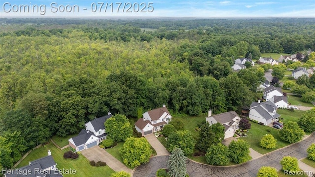 3066 Waldon Park Dr, Orion, MI 48359 - aerial perspective of suburban area featuring a heavily wooded area