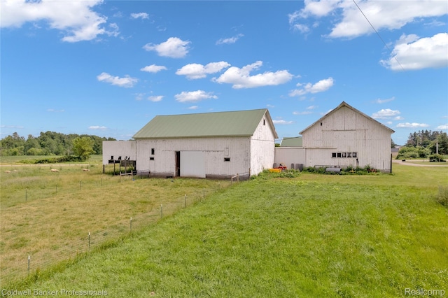 4677 Imlay City Rd, Attica, MI 48412 - view of property exterior featuring an outbuilding, a barn, and a metal roof