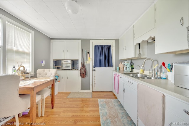 4677 Imlay City Rd, Attica, MI 48412 - kitchen with light countertops, light wood-type flooring, and white cabinetry