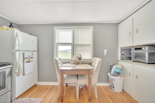 4677 Imlay City Rd, Attica, MI 48412 - dining room with light wood finished floors and crown molding