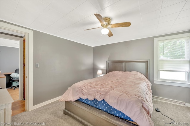 4677 Imlay City Rd, Attica, MI 48412 - bedroom featuring carpet, a baseboard heating unit, and ceiling fan