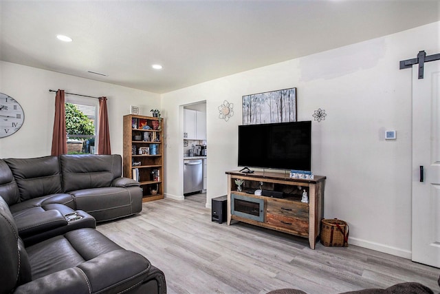 320 E Dr, Marshall, MI 49068 - living room with a barn door, light wood-style flooring, and recessed lighting