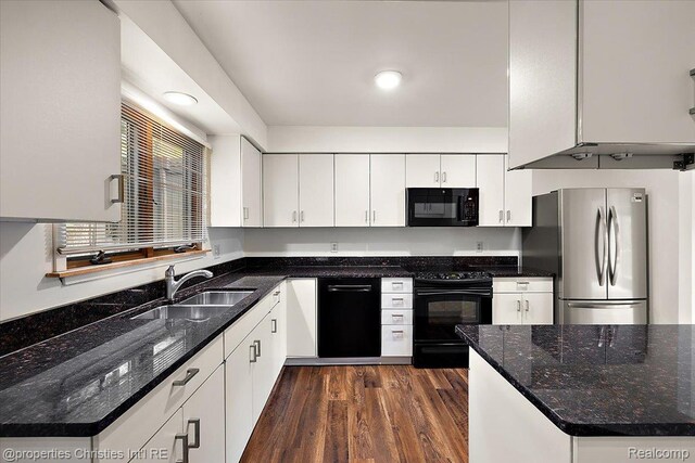 2 Eastbury Ct, Ann Arbor, MI 48105 - kitchen featuring black appliances, dark wood-style flooring, white cabinets, dark stone countertops, and recessed lighting