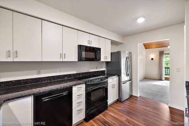 2 Eastbury Ct, Ann Arbor, MI 48105 - kitchen with black appliances, white cabinets, dark wood finished floors, and dark stone counters