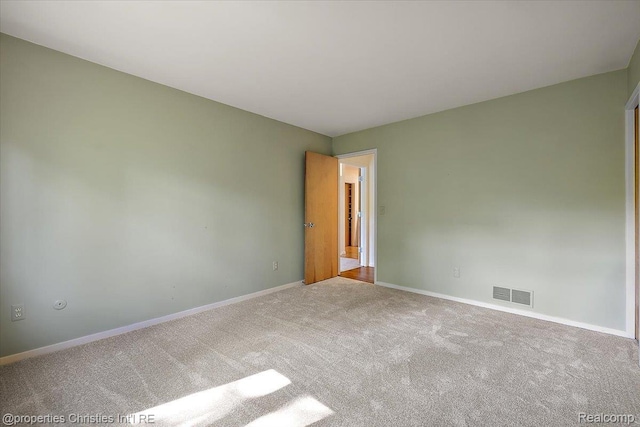 2 Eastbury Ct, Ann Arbor, MI 48105 - spare room featuring carpet and baseboards