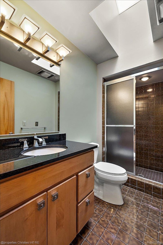 2 Eastbury Ct, Ann Arbor, MI 48105 - bathroom featuring vanity, tile patterned floors, and a stall shower