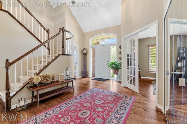 510 Roxbury Dr, Lake Orion, MI 48359 - entryway with high vaulted ceiling, stairway, wood finished floors, and french doors