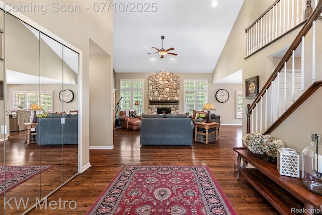 510 Roxbury Dr, Lake Orion, MI 48359 - living room with high vaulted ceiling, a ceiling fan, healthy amount of natural light, stairway, and wood finished floors