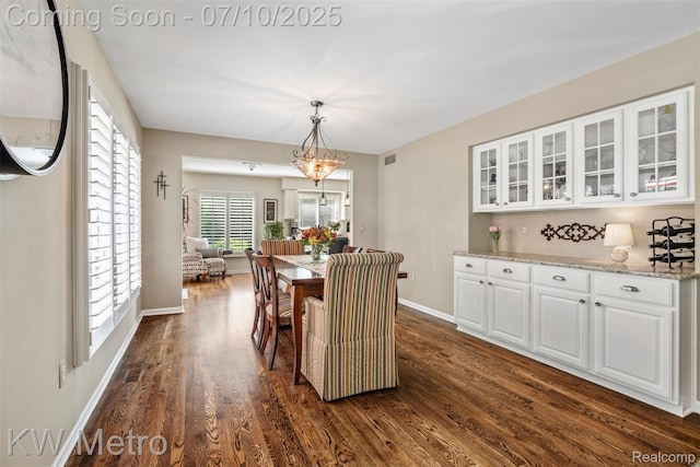 510 Roxbury Dr, Lake Orion, MI 48359 - dining area with dark wood-style flooring and a chandelier