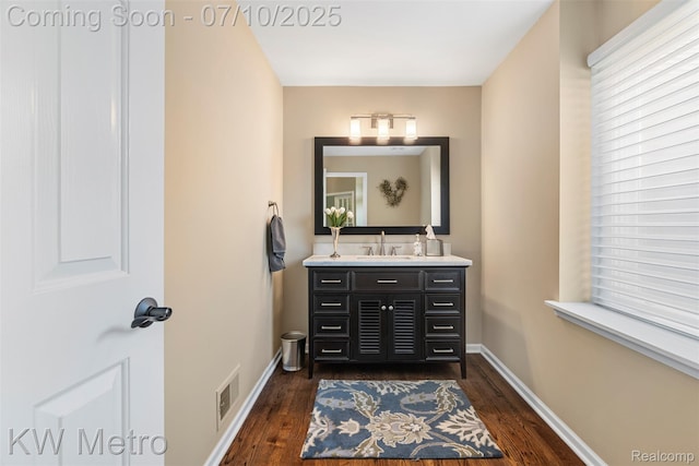 510 Roxbury Dr, Lake Orion, MI 48359 - half bath featuring vanity and wood finished floors