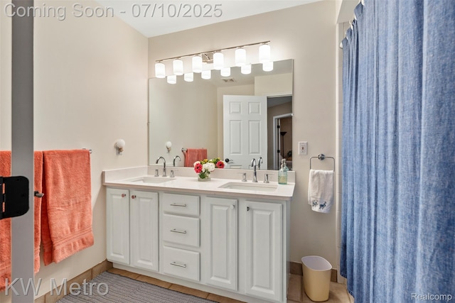 510 Roxbury Dr, Lake Orion, MI 48359 - full bathroom featuring tile patterned floors and double vanity