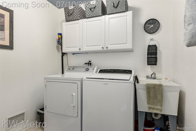 510 Roxbury Dr, Lake Orion, MI 48359 - laundry area featuring cabinet space and washing machine and clothes dryer