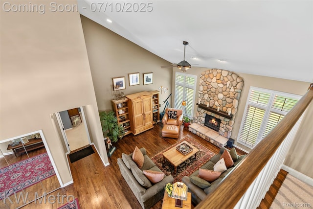 510 Roxbury Dr, Lake Orion, MI 48359 - living room with high vaulted ceiling, a ceiling fan, a fireplace, and wood finished floors