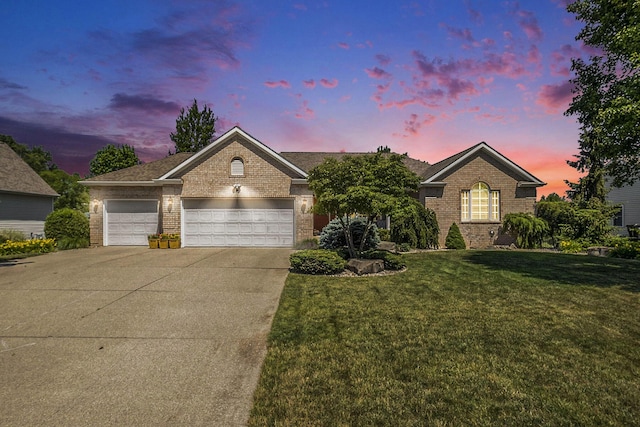 6177 Heathcross Dr, Hudsonville, MI 49426 - view of front of house featuring brick siding, a front yard, an attached garage, and concrete driveway