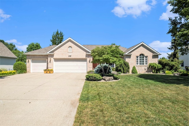 6177 Heathcross Dr, Hudsonville, MI 49426 - view of front of home with brick siding, an attached garage, concrete driveway, and a front yard