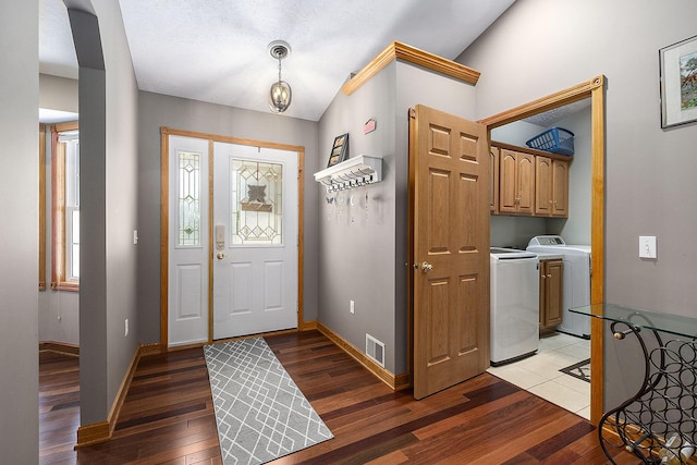 6177 Heathcross Dr, Hudsonville, MI 49426 - foyer featuring vaulted ceiling, light wood-style flooring, and washer and dryer