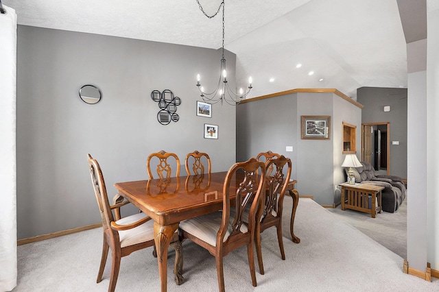 6177 Heathcross Dr, Hudsonville, MI 49426 - dining room featuring lofted ceiling, light colored carpet, and a chandelier