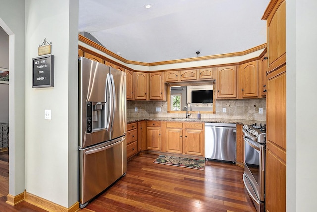 6177 Heathcross Dr, Hudsonville, MI 49426 - kitchen featuring appliances with stainless steel finishes, dark wood-type flooring, backsplash, lofted ceiling, and light stone counters