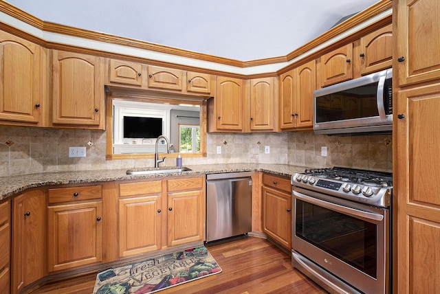 6177 Heathcross Dr, Hudsonville, MI 49426 - kitchen featuring appliances with stainless steel finishes, light stone counters, backsplash, and crown molding
