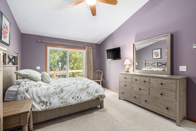6177 Heathcross Dr, Hudsonville, MI 49426 - bedroom featuring access to exterior, lofted ceiling, light carpet, and a ceiling fan