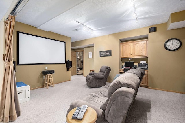 6177 Heathcross Dr, Hudsonville, MI 49426 - home theater featuring track lighting, light colored carpet, and a textured ceiling