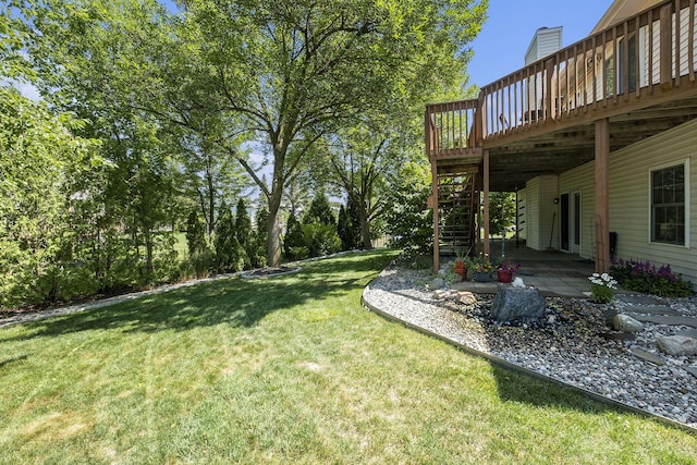 6177 Heathcross Dr, Hudsonville, MI 49426 - view of grassy yard featuring a wooden deck, stairway, and a patio