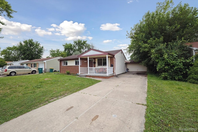 15447 Taft St, Westland, MI 48174 - ranch-style home with covered porch, a front lawn, brick siding, and driveway