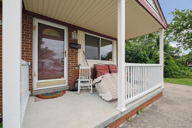 15447 Taft St, Westland, MI 48174 - doorway to property with a porch and brick siding