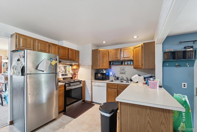 15447 Taft St, Westland, MI 48174 - kitchen featuring stainless steel appliances, under cabinet range hood, light countertops, a peninsula, and recessed lighting