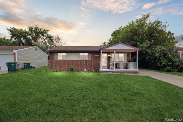 15447 Taft St, Westland, MI 48174 - single story home with covered porch, brick siding, and a front yard