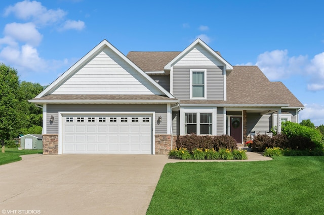 6044 Wabash Ln, Stevensville, MI 49127 - view of front of house with driveway, a front lawn, stone siding, and a storage unit