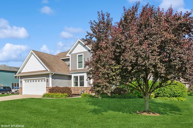 6044 Wabash Ln, Stevensville, MI 49127 - obstructed view of property with stone siding, a garage, a front yard, and concrete driveway