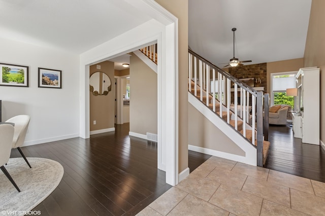 6044 Wabash Ln, Stevensville, MI 49127 - foyer featuring wood-type flooring, a ceiling fan, and stairway