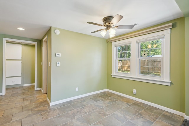 3049 Kooi St, Muskegon, MI 49444 - empty room with a smoke detector, stone finish flooring, ceiling fan, and recessed lighting