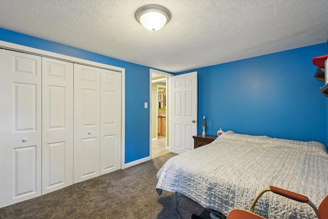 3049 Kooi St, Muskegon, MI 49444 - bedroom featuring carpet flooring, a closet, and a textured ceiling