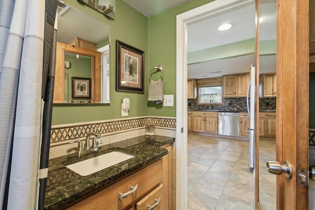 3049 Kooi St, Muskegon, MI 49444 - bathroom featuring vanity and backsplash