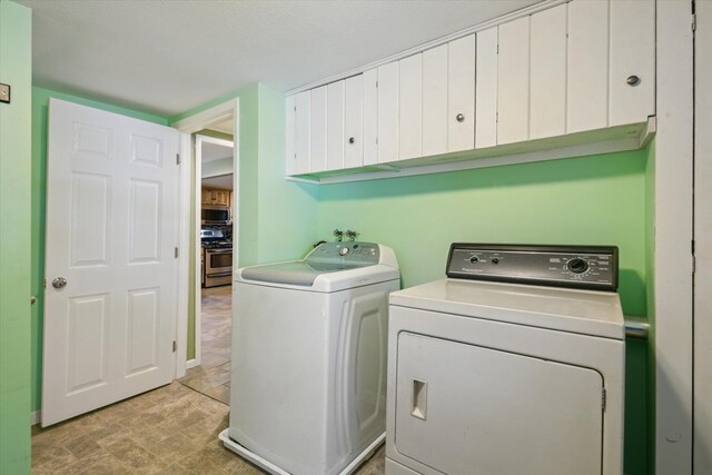 3049 Kooi St, Muskegon, MI 49444 - washroom featuring washer and clothes dryer and cabinet space