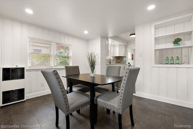 18714 Appoline St, Detroit, MI 48235 - dining space featuring heating unit, a decorative wall, and recessed lighting