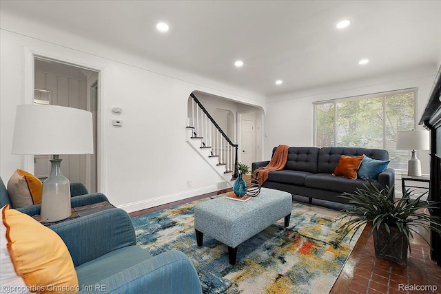 18714 Appoline St, Detroit, MI 48235 - living room featuring recessed lighting, arched walkways, and stairway