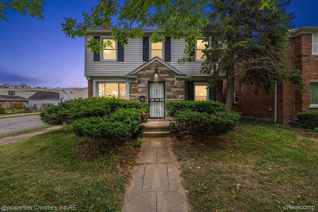 18714 Appoline St, Detroit, MI 48235 - view of front of home featuring a yard and brick siding