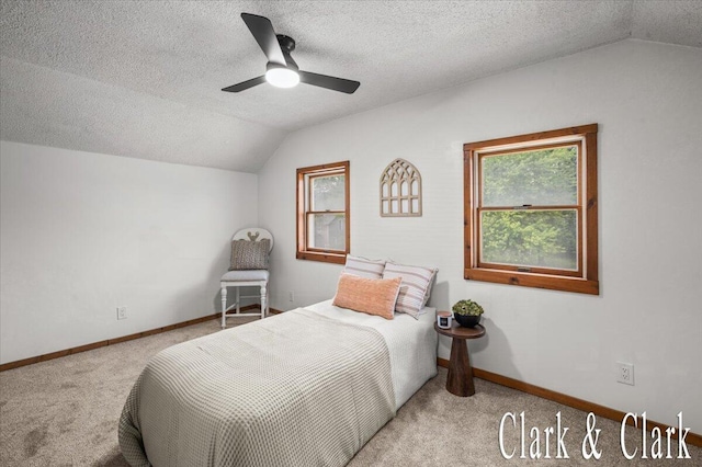 139 W Grand Ledge Hwy, Sunfield, MI 48890 - carpeted bedroom with vaulted ceiling, a textured ceiling, and ceiling fan