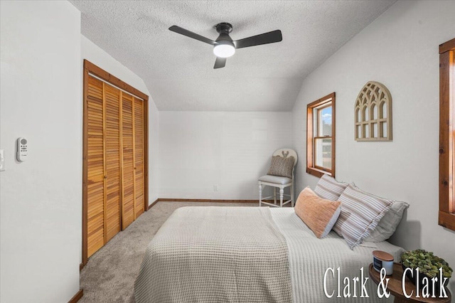 139 W Grand Ledge Hwy, Sunfield, MI 48890 - carpeted bedroom with a textured ceiling, lofted ceiling, a closet, and a ceiling fan