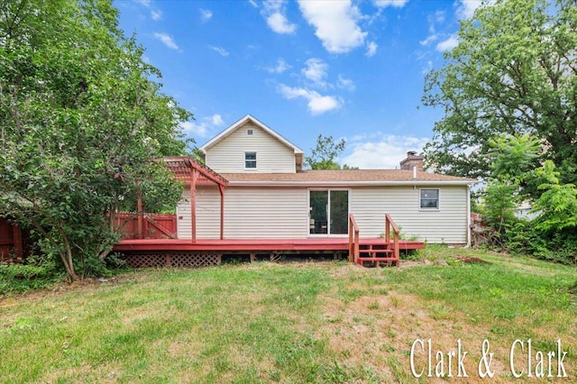 139 W Grand Ledge Hwy, Sunfield, MI 48890 - rear view of house with a deck, a lawn, and a chimney