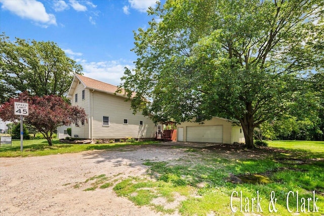 139 W Grand Ledge Hwy, Sunfield, MI 48890 - view of property exterior with a garage