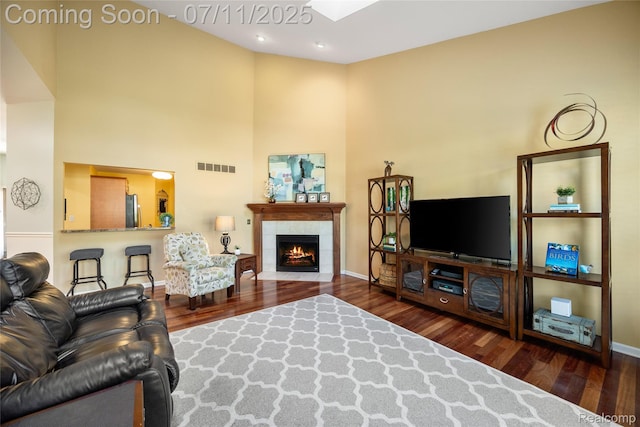 52221 Giuliano Ln, Macomb, MI 48042 - living room featuring wood finished floors, a fireplace, and a high ceiling